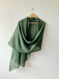 This Dark Green Shawl is a handmade luxury wrap perfect for formal events, serving as an elegant statement piece and wedding guest accessory. Crafted as a versatile cocktail party knit and evening wear cover-up, this shawl combines sophistication with practicality, making it an ideal choice for various special occasions. Luxurious Handmade Dark Green Shawl: Your Essential Formal Event Accessory - Handcrafted using fine mohair and silk blend yarn for a soft, lightweight texture that offers both warmth and style - Available in two sizes: regular (78x18 inches) and oversized (102x25 inches) to suit your preference and outfit - Versatile accessory suitable for weddings, evening parties, proms, cocktail events, and other formal or semi-formal occasions - Timeless dark green color provides a ric Luxury Wrap, Shawl For Wedding, Comic Con Outfits, Emerald Green Bridesmaid Dresses, Green Shawl, Wedding Guest Accessories, Party Dress Ideas, Dress With Shawl, Dark Green Color