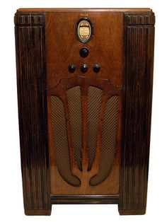 an old fashioned radio is on display against a white background