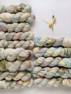 several skeins of yarn sitting on top of each other