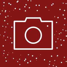 a camera on a red background with white snow flecks and circles around it