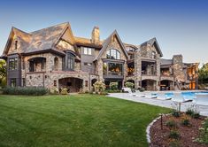 a large house with a pool in the front yard