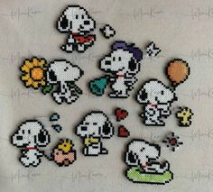 the pixel art is being displayed on a white cloth with flowers and other items in it