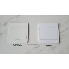 two white switches sitting on top of a marble counter next to each other with the words off - white written below them