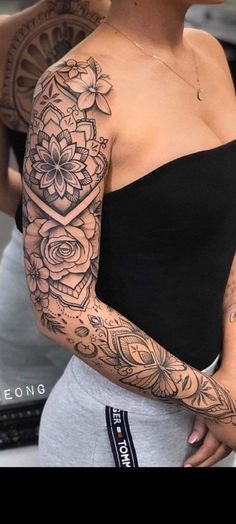 a woman with a tattoo on her arm