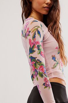 Effortlessly essential with a slight ethereal touch, this timeless top is featured in a fitted, long sleeve silhouette with stunning floral printing throughout, semi-sheer sleeves, and defined seaming for added dimension. **Fit:** Fitted, classic style **Features:** Scoop neckline, defined seaming, semi-sheer sleeves **Why We | Betty's Garden Top by Free People in Red, Size: XS Floral Printing, Fitted Long Sleeve, Chic Fall Outfits, Mesh Shirt, Retro Tops, Dope Outfits, Sheer Sleeves, Floral Shirt, Cool Tees