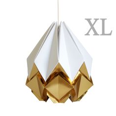 an origami light hanging from a ceiling fixture with the word xx above it