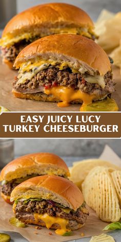 two cheeseburger sandwiches sitting on top of a cutting board next to potato chips