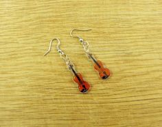 These earrings, presenting hand-painted violin, are dedicated to music lovers (not only!). The hooks are made of hypo-allergenic nickel and lead-free steel. Measurements: Width: 1 cm Length including the hook:  5,8 cm Thickness: 1,5 mm The earrings are made of shrink plastic. They are additionally covered with glossy varnish in order to protect the drawing from dirt and moisture. However, longer contact with water is not advised (shower, swimming pool). Because the earrings are 100% handmade (dr Fox Earrings, Romantic Jewelry, Romantic Jewellery, Shrink Plastic, Le Crochet, Gift For Music Lover, Cat Earrings, Music Lover, Music Lovers