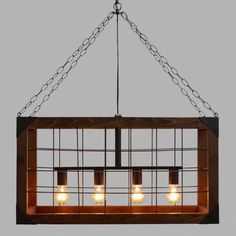 a light fixture with four lights hanging from it's center and two bulbs on each side