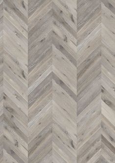 an image of wood flooring that looks like chevron herringbones in grey and white