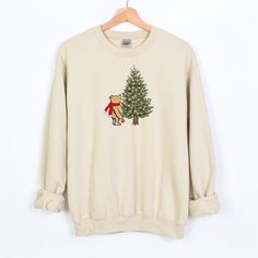 Winnie the Pooh Christams Sweatshirt, Winnie the Pooh Gift, Classic Pooh Sweater, Vintage Pooh Crewneck, Christmas Winnie the Pooh Sweater It's the most wonderful time of the year! :D This Christmas sweatshirt is cozy and adorable, a unisex heavy blend crewneck sweatshirt that is pure comfort. These garments are made from polyester and cotton. This combination helps designs come out looking fresh and beautiful. The collar is ribbed knit, so it retains its shape even after washing. There are no i Christmas Winnie The Pooh, Knit Christmas Sweater, Cozy Christmas Outfit, Vintage Pooh, Christmas Tree Sweater, Cute Christmas Sweater, Classic Pooh, Christmas Pullover, Tree Sweater