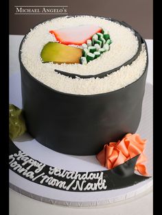 a birthday cake with an image of a sushi on it