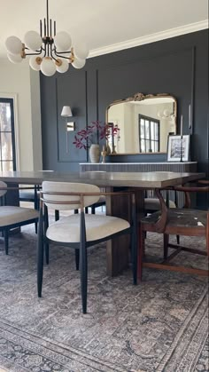 a dining room table with chairs and a mirror in the background that says, dinner room faq