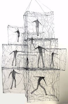 an artistic sculpture made out of wire with people in the center and one person on top