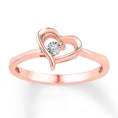 A single diamond accent embraced within a heart is the sparkling focal point in this affectionate ring for her. The ring is crafted in 10K rose gold. Promise Ring Diamond, Rose Gold Promise Ring, Heart Promise Rings, Jewelry Advice, Geode Earrings, Diamond Heart Ring, Diamond Promise Rings, Retro Ring, Rose Gold Diamond Ring