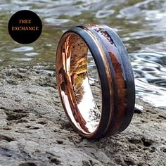 an image of a wedding ring made out of wood and copper