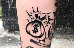 a tattoo on the leg of a man with a bag of money in his hand