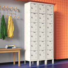 two lockers with coats hanging on them in a room that is painted orange and gray