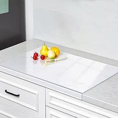 the kitchen counter is clean and ready to be used as a cutting board for fruit