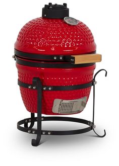 a large red bbq grill sitting on top of a stand