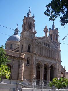 an old building with two towers and three spires