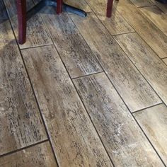 a wooden floor that has been cleaned and is sitting in the middle of a room