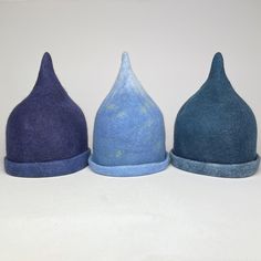 Handfelted hats for winter swimming and sauna.  Protects your head from both heat loss in cold water and from heat in the sauna. Also makes the swimming more fun.  Fine merino and supersoft. This design is called 'Tip-top'  Various colors. The saunahats are all handmade and unique. The colors can vary, also a bit from the photo. You can order for a team of swimmers and maybe have a logo added, if you have one. It takes a bit longer then. Can be used as a hat in all kinds of weather and environments. 3 sizes  Small 55-56 cm Medium 57-58 cm Large 59-60 cm Blue Wool Hat For Winter, Blue Wool Cap, Blue Felt Hat For Winter, Blue Mini Hats For Winter, Adjustable Blue Mini Hat For Winter, Adjustable Blue Winter Mini Hat, Adjustable Blue Mini Winter Hats, Blue Outdoor Hat, Blue Mini Hats With Curved Brim For Winter