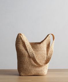 Raffia Crossbody Bag Natural OS This textured bag is perfectly packable and made to fit just about anything that's needed for all your summer outings. Crochet raffia bag. Made in China. | Jenni Kayne Raffia Crossbody Bag Straw Cross Body Bag, Raffia Crossbody Bag, Versatile Woven Shoulder Bucket Bag, Versatile Natural Hobo Tote Bag, Natural Color Crossbody Travel Bag, Natural Crossbody Travel Bag, Versatile Natural Hobo Bag With Double Handle, Versatile Natural Color Hobo Bag With Double Handle, Natural Hobo Shoulder Bag For Daily Use