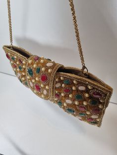 This exquisite clutch comes in three colours. Beautifully embroidered in gold and multocoloured rhinestones. Base colour black, maroon and mustard yellow velvet. Snatch yours before they're gone. Pearl Clutch, Beautiful Handbags, Pretty Bags, How To Make Handbags, Three Color, Clutch Purse, Clutch Handbag, Mustard Yellow, Base Colour