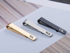 This tie clip is an essential accessory for any man! It's the perfect gift choice for men. Whenever and wherever you wear a tie, it's the perfect match. We use stainless steel to ensure its durability. ❤DETAILS ✿ Material：Stainless Steel. ✿ Tag Color：Gold, Black, Sliver,Rose gold ✿ Size: 1.8x0.31inch(4.7x0.8cm) ✿ Material: stainless steel ✿ Processing: laser engraving ❤PERSONALIZATION ⭐9 fonts are available for you to choose from. If you can't find your favorite one or have your own ideas, Feel Wedding Tie Clip, Men Tie, Bar Wedding, Wedding Tie, Special Symbols, Bar Items, Tie Tack, Tie Bar, Velvet Bag