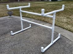 a white pipe rack sitting on top of a sidewalk