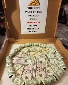 a pizza box with money in it and a sign that says the best part of the pizza is the $ 500 happy birthday