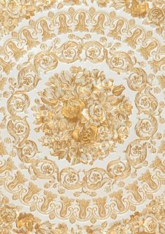 an ornate gold and white wallpaper with flowers