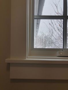 a window sill with a remote control on it