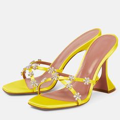 Step into elegance with these yellow satin square-toe flared-heel mules sandals. The dazzling rhinestone floral embellishments and unique flared heels make them perfect for special occasions. Color: Yellow Material: Satin Heel Type: Flared heel Heel height: 4" / 100 mm approx Product measurements were taken using size 8. Please note that measurements may vary by size. Toe: Open square toe Rhinestone floral embellishment Handcrafted US sizing. Fits true to size. Glamorous Yellow Party Sandals, Yellow Heels With Square Toe For Party, Yellow Square Toe Party Heels, Yellow Square Toe Heels For Party, Summer Rhinestone Heels With Square Toe, Yellow Open Toe Sandals With Rhinestones, Yellow Heels With Rhinestones For Party, Party Yellow Heels With Rhinestones, Yellow Rhinestone Heels For Party