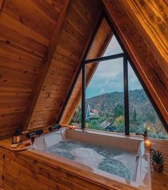 a bathroom with a large jacuzzi tub in the corner and a view out the window