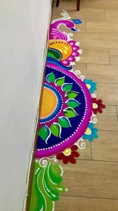 the floor is decorated with colorful designs on it