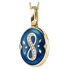 Victor Mayer oval locket pendant with infinity symbol 18k yellow gold, Victoria Collection, translucent peacock blue vitreous enamel, gold paillons, 12 diamonds, total 0.08 ct, G VS, brilliant cut, measurements app. 15.0 mm x 20.0 mm About the creator Victor Mayer Victor Mayer is internationally renowned for elegant timeless designs and unrivalled expertise in historic craftsmanship. Lovers of the extraordinary appreciate the beauty of Victor Mayer's designs, which use extremely rare techniques such as genuine enamel or elaborate engravings. Since 1890, the company has stood for the finest jewellery Hand Made in Germany. It is an open secret that the most renowned brands, such as Fabergé, entrust the company with the production of their most exquisite collections. Reference: V1753/PE/00/00 Vitreous Enamel, Oval Locket, Anchor Chain, Locket Pendant Necklace, Luminous Colours, Infinity Symbol, Peacock Blue, Wave Pattern, High Quality Jewelry