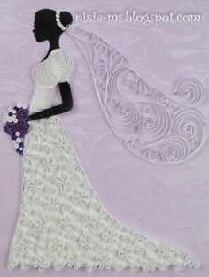 a paper cutout of a bride holding her bouquet in her hand and wearing a wedding dress