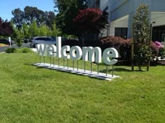 a welcome sign in front of a building