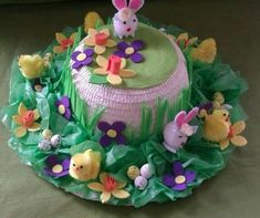 a cake decorated with flowers and easter decorations