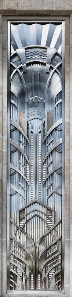 an art deco door in the shape of a cityscape with buildings on it