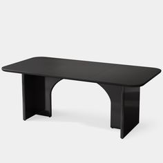 a black table sitting on top of a white floor