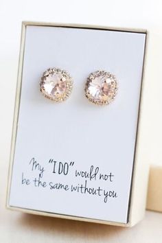 a pair of pink earrings sitting on top of a white card with the words, my 100'would not be the same without you