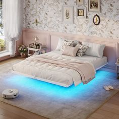 a bed with blue light under it in a room next to a window and rug