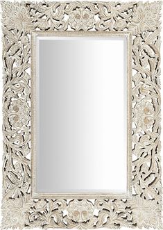 an ornate white mirror is shown against a white background