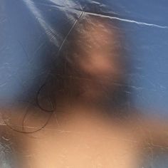 a blurry image of a person's head and hair