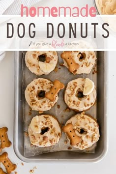 homemade dog donuts with white frosting and sprinkles in a baking pan