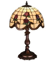 a stained glass lamp with roses on it