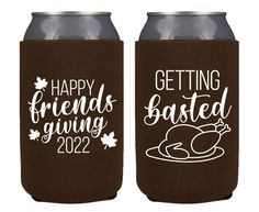 two brown can coolers with white lettering saying happy friends giving roasted turkey on them